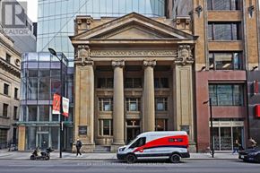 Toronto (Church-Yonge Corridor) condo for rent - A van is parked in front of the Canadian Bank of Commerce.