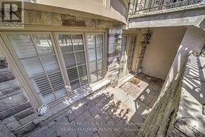 Toronto (Forest Hill South) triplex for rent - A balcony with a table and chairs is seen from above.