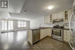 Toronto (Forest Hill South) triplex for rent - A kitchen with a refrigerator, oven, and cabinets.