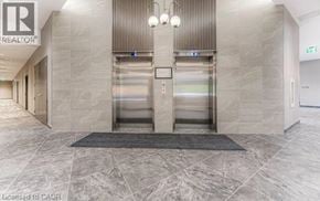 Kitchener condo for rent - A hallway with a sign that says REALTOR.