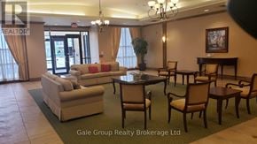 Brampton (Sandringham-Wellington) condo for rent - A living room with a couch, chairs, and a fireplace.