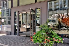 Toronto (Bay Street Corridor) condo for rent - The front of a building with a glass door and a sign that says "LUMBER BAY".