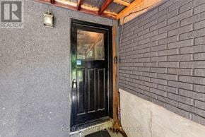 Ottawa apartment for rent - A black door with a glass window is seen in the image.