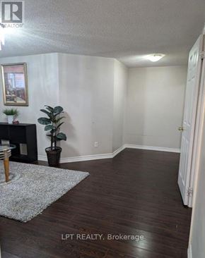 Vaughan (Maple) apartment for rent - A room with a fireplace and a potted plant.