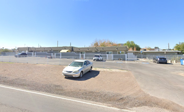Henderson apartment for rent - A white car is parked on the side of a road.