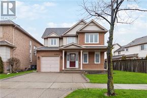 Burlington (Orchard) apartment for rent - A large house with a red door is for sale.