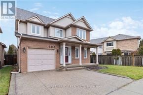 Burlington (Orchard) apartment for rent - A two-story house with a garage is for sale.