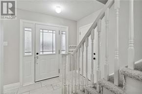 Burlington (Orchard) apartment for rent - A white staircase with a glass door at the end.