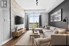 Burlington (Uptown) condo for rent - A living room with a flat screen TV mounted on a stone wall.