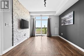 Burlington (Uptown) condo for rent - A modern living room with a stone wall and a flat screen TV.