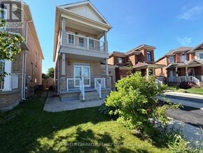 Brampton (Madoc) apartment for rent - A sunny day at a residential area with houses and greenery.