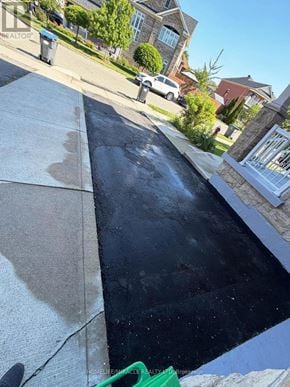 Brampton (Madoc) apartment for rent - A blacktop driveway with a white border.