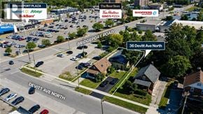 Waterloo apartment for rent - An aerial view of a parking lot with a sign that reads "Bridgeport Plaza" and "36 Devitt Ave North.".