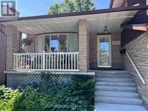 Kingston (North Of Taylor-Kidd Blvd) apartment for rent - A house with a porch and stairs leading to the front door.