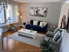Kingston (North Of Taylor-Kidd Blvd) apartment for rent - A living room with a blue couch and a white coffee table.