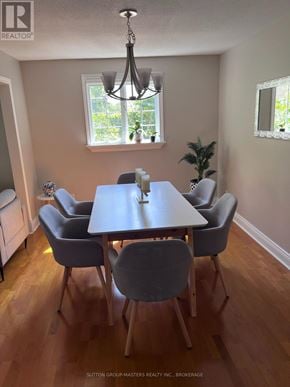 Kingston (North Of Taylor-Kidd Blvd) apartment for rent - A dining room with a table and chairs.
