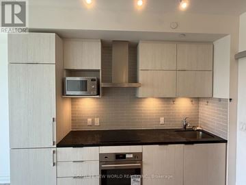 Markham (Unionville) condo for rent - A kitchen with a microwave above the stove.