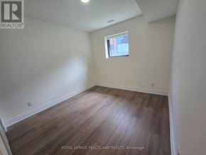 Toronto (University) apartment for rent - A room with wooden flooring and a window.