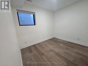 Toronto (University) apartment for rent - A room with a window and wooden flooring.
