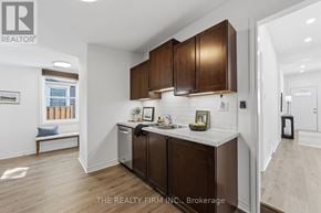 London East (East K) apartment for rent - A kitchen with brown cabinets and a marble countertop.