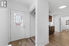 London East (East K) apartment for rent - A white door with a glass window and a stained glass window on the other side.