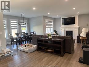 Belle River apartment for rent - A living room with a fireplace and a television on the wall.
