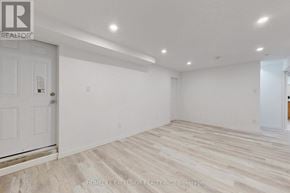 Barrie (Cundles East) apartment for rent - A spacious room with wooden flooring and white walls.
