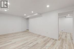 Barrie (Cundles East) apartment for rent - A spacious room with wooden flooring and white walls.