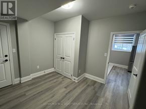 Milton (Walker) apartment for rent - A room with a white door and grey walls.