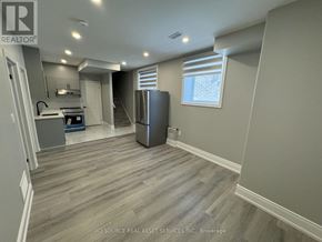 Milton (Walker) apartment for rent - A kitchen with a refrigerator, stove, and sink.