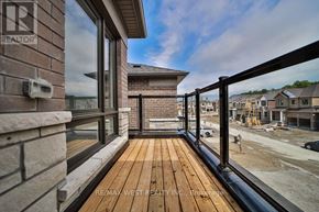 Springwater (Minesing) apartment for rent - A balcony with a wooden floor and a glass railing.