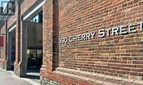 Toronto (Waterfront Communities) condo for rent - A brick building with a sign that says Cherry Street.
