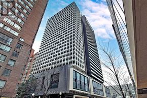 Toronto (Bay Street Corridor) condo for rent - A tall building with the words "MAX ELITE REAL ESTATE" on the side.