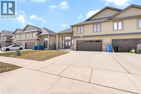 Essex townhouse for rent - A real estate photo of a house with a driveway in front.