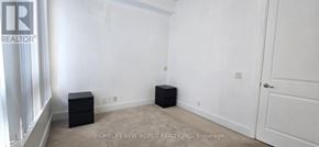 Toronto (Bay Street Corridor) condo for rent - A white room with a door and a black box on the floor.