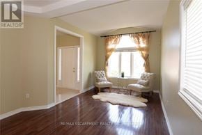 Hamilton (Meadowlands) apartment for rent - A living room with a cowhide rug and two chairs.