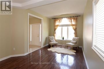 Hamilton (Meadowlands) apartment for rent - A living room with a cowhide rug and two chairs.