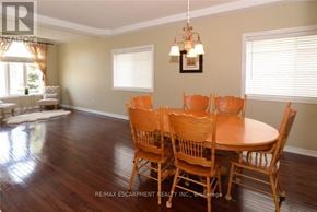 Hamilton (Meadowlands) apartment for rent - A dining room with a wooden table and chairs.