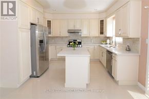 Hamilton (Meadowlands) apartment for rent - A kitchen with white cabinets and appliances.