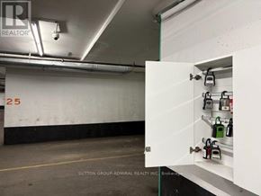 Toronto (Willowdale East) condo for rent - A brokerage office with a white cabinet holding files and a sign that says REALTOR.