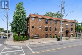 Hamilton (Stinson) multi-family for rent - A street view of a building with the sign RE/MAX Escarpment Realty Inc. Brokerage.