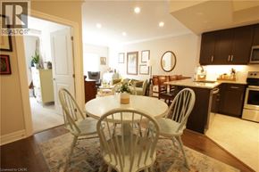 Stratford condo for rent - A dining room with a white table and chairs.