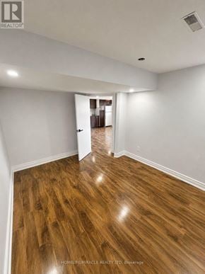 Pickering (Brock Ridge) apartment for rent - A room with wooden flooring and white walls.