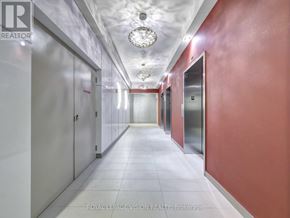 Toronto (Woburn) condo for rent - A long hallway with a light on the ceiling and doors on the side.
