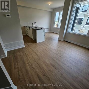 Ottawa townhouse for rent - A kitchen with a sink and a window.