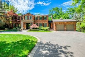 Oakville (Mo Morrison) apartment for rent - A large brick house with a driveway in front.