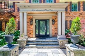 Oakville (Mo Morrison) apartment for rent - The front entrance of a building with a sign that reads "1251 Lakeshore Road East".