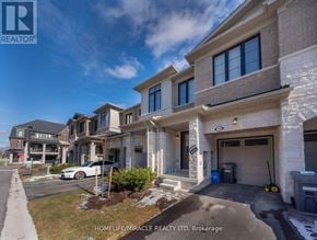 Burlington (Tyandaga) townhouse for rent - A row of houses with the text HOMELIFE/MIRACLE REALTY LTD, Brokerage on the bottom.