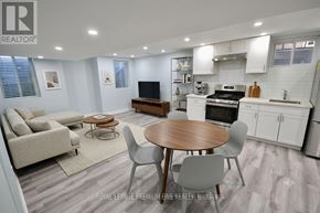 Vaughan (Kleinburg) apartment for rent - A well-lit kitchen and living room with a dining table and chairs.