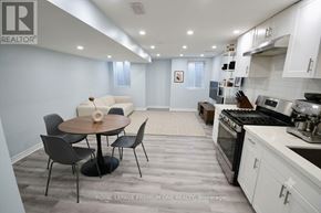 Vaughan (Kleinburg) apartment for rent - A modern kitchen with a dining table and chairs.